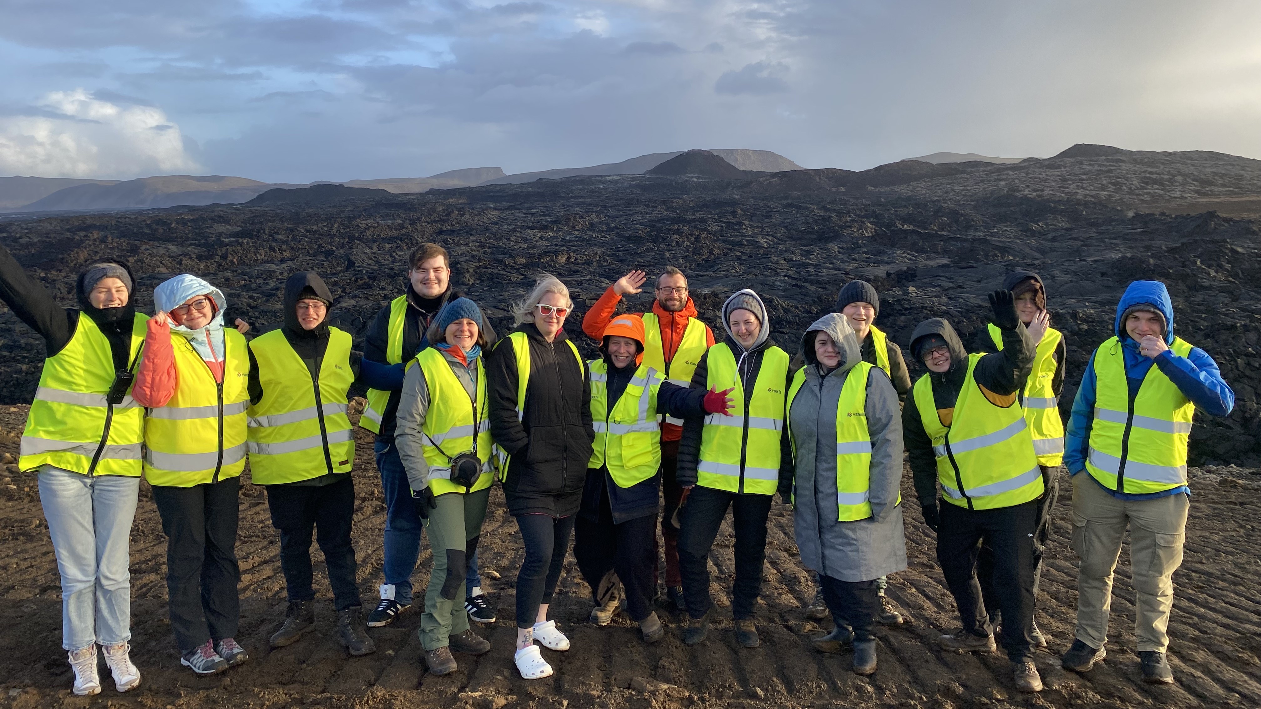 A group students and lecturers standing in a bleak Icelandic landscape A group students and lecturers standing in a bleak Icelandic landscape