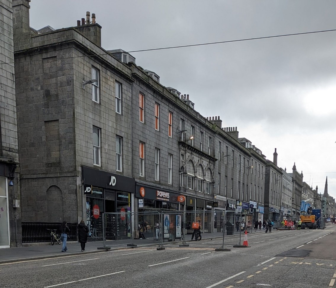 Picture of street in Aberdeen showing shops with flats above