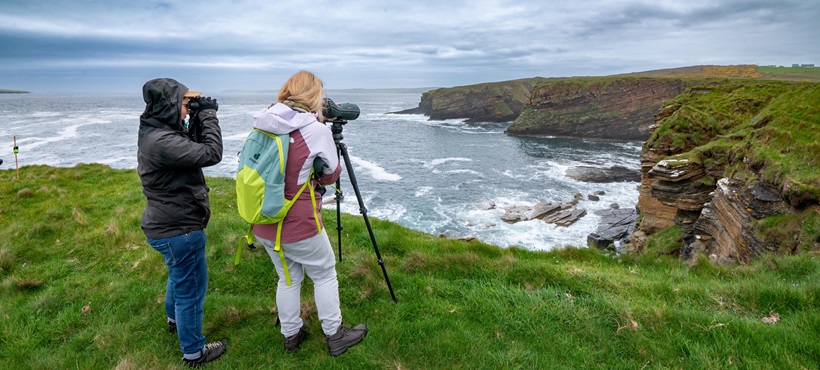 Photographer on a cliffside Photographer on a cliffside