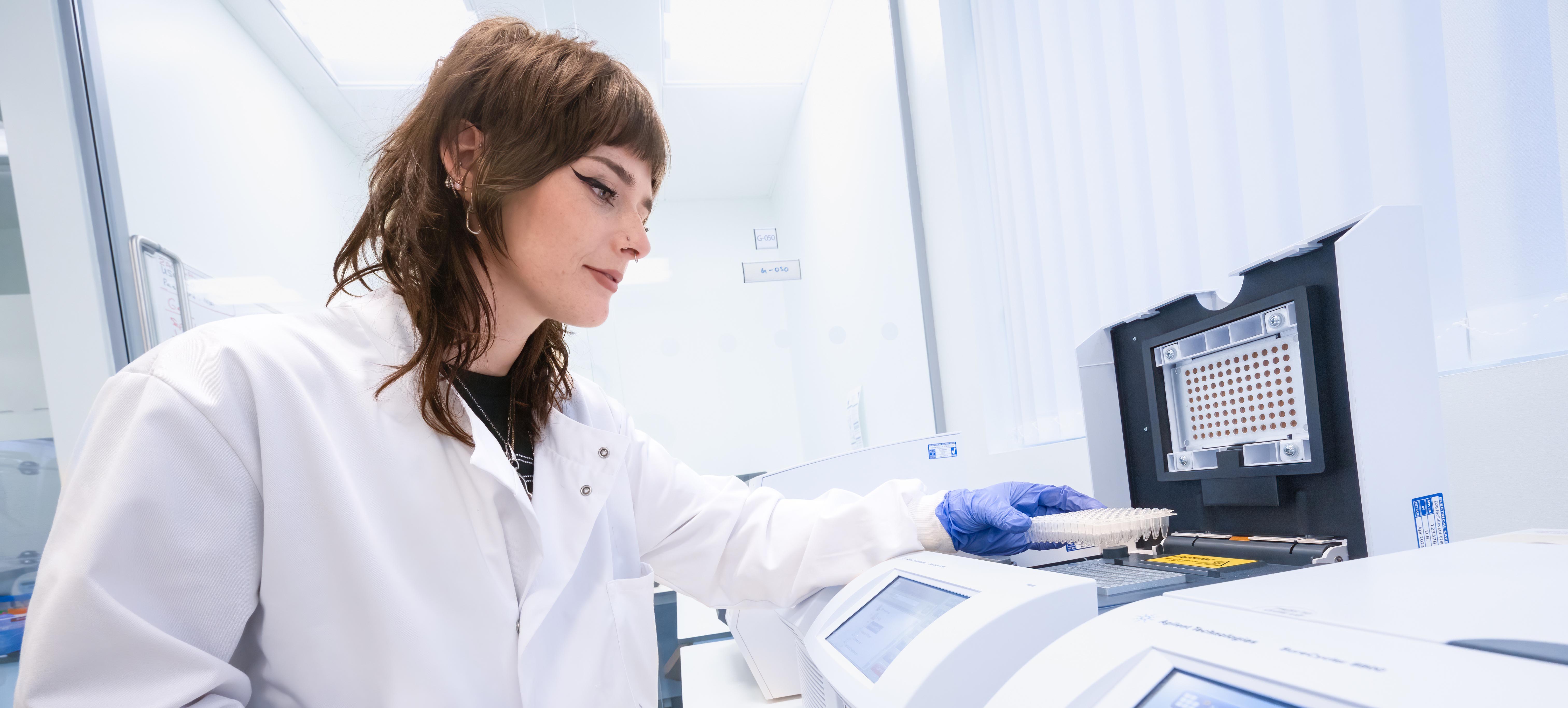 A female research in a laboratory. A female research in a laboratory.