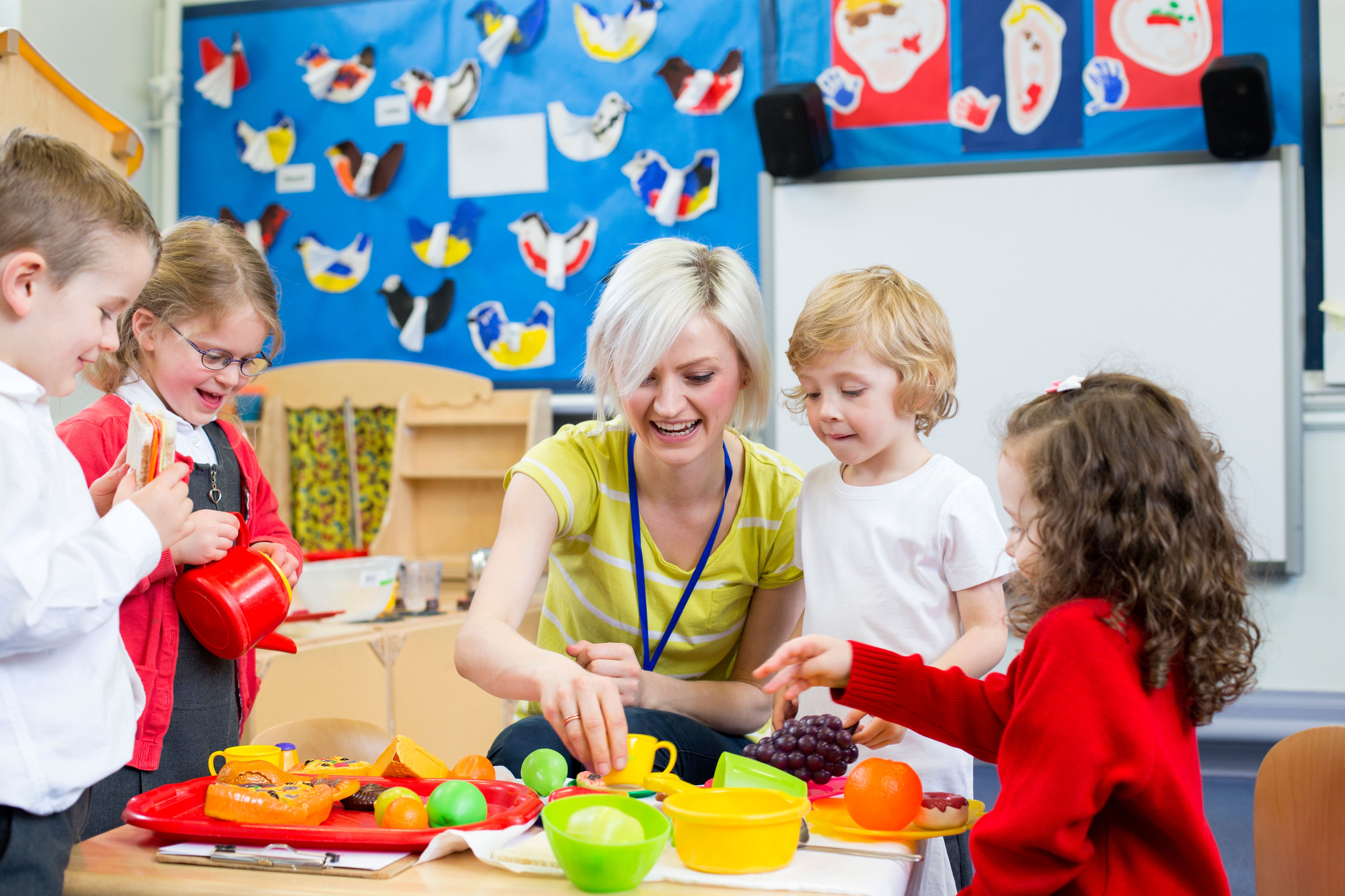 teacher with a group of nursery students